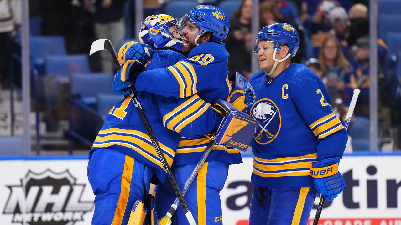 BUFFALO, NY - OCTOBER 13: Kyle Okposo #21 and Alex Tuch #89 celebrate with Craig Anderson #41 of the Buffalo Sabres after an NHL game against the Ottawa Senators on October 13, 2022 at KeyBank Center in Buffalo, New York. Buffalo won, 4-1.
