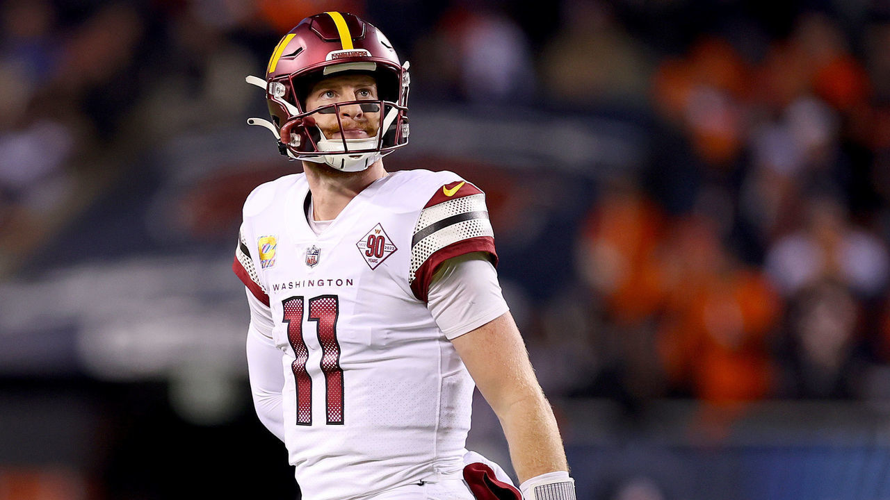 CHICAGO, ILLINOIS - OCTOBER 13: Carson Wentz #11 of the Washington Commanders looks on after failing to convert on third down during the second quarter against the Chicago Bears at Soldier Field on October 13, 2022 in Chicago, Illinois.
