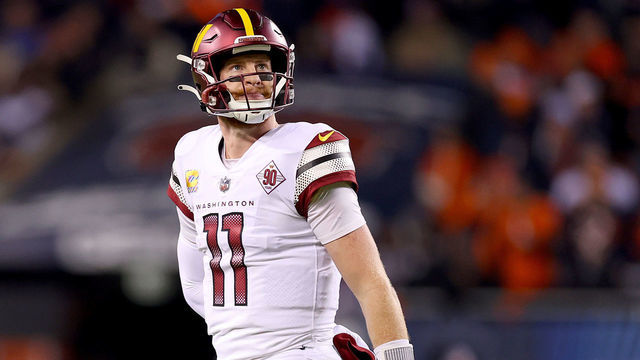 CHICAGO, ILLINOIS - OCTOBER 13: Carson Wentz #11 of the Washington Commanders looks on after failing to convert on third down during the second quarter against the Chicago Bears at Soldier Field on October 13, 2022 in Chicago, Illinois.