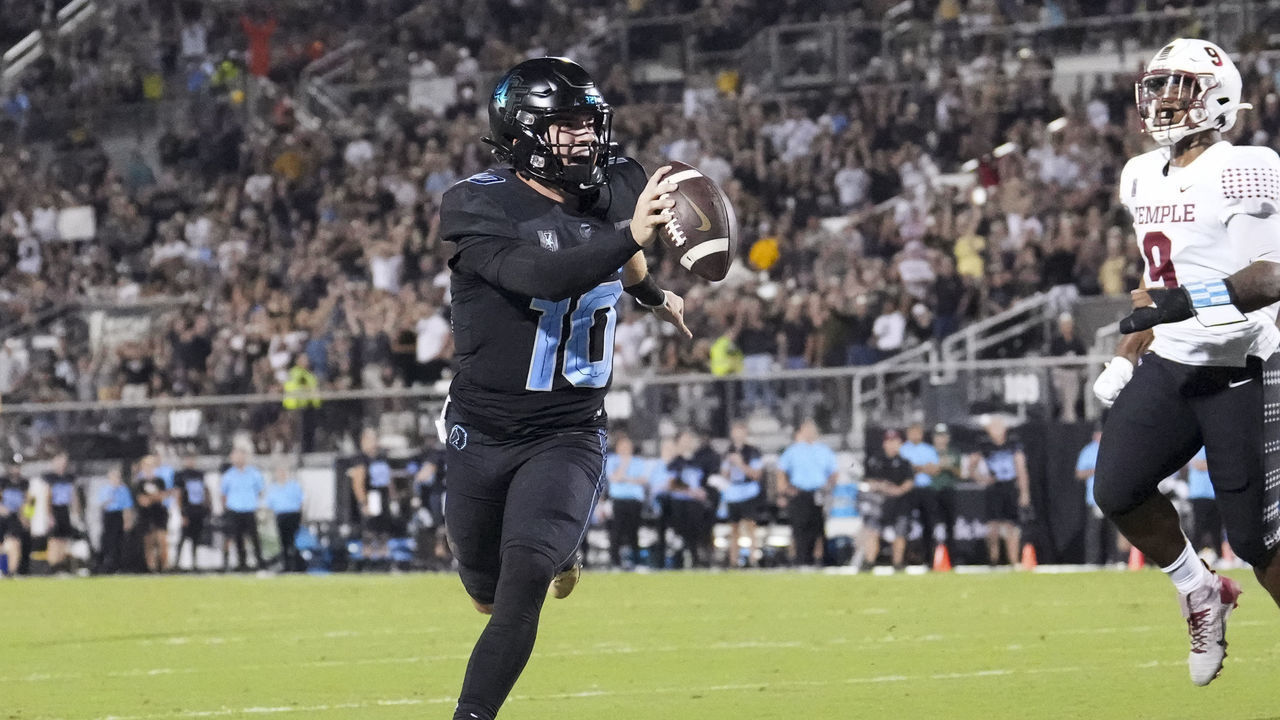 ORLANDO, FL - OCTOBER 13: UCF Knights quarterback John Rhys Plumlee (10) celebrates his touchdown run during the game between the Temple Owls and the University of Central Florida (UCF) Knights on Thursday, October 13, 2022 at Bright House Networks Stadium in Orlando, FL