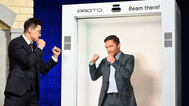 VAN NUYS, CA - OCTOBER 13: DK Yoo faces off with Manny Pacquiao who appeared in a hologram during a press conference on October 13, 2022 in Van Nuys, California.
