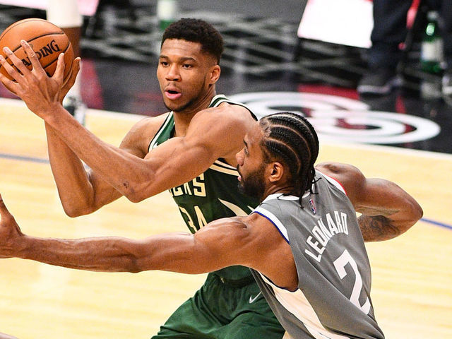 LOS ANGELES, CA - MARCH 29: Milwaukee Bucks Forward Giannis Antetokounmpo (34) guarded closely by Los Angeles Clippers Forward Kawhi Leonard (2) during a NBA game between the Milwaukee Bucks and the Los Angeles Clippers on March 29, 2021 at STAPLES Center in Los Angeles, CA. The game was played without fans due to the COVID-19 pandemic.