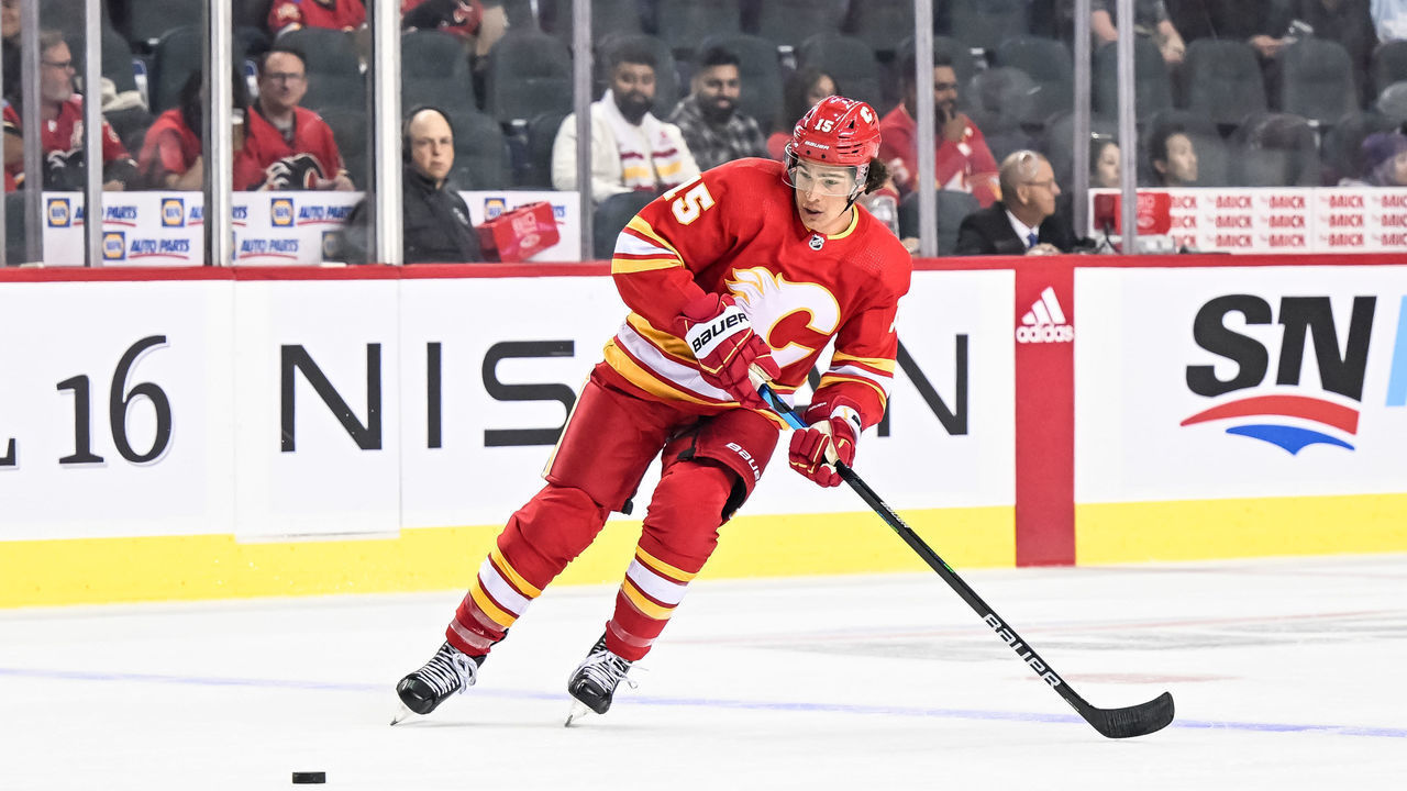 CALGARY, AB - SEPTEMBER 25: Calgary Flames Left Wing Sonny Milano (15) receives a pass during the first period of an NHL pre-season game between the Calgary Flames and the Vancouver Canucks on September 25, 2022, at the Scotiabank Saddledome in Calgary, AB.
