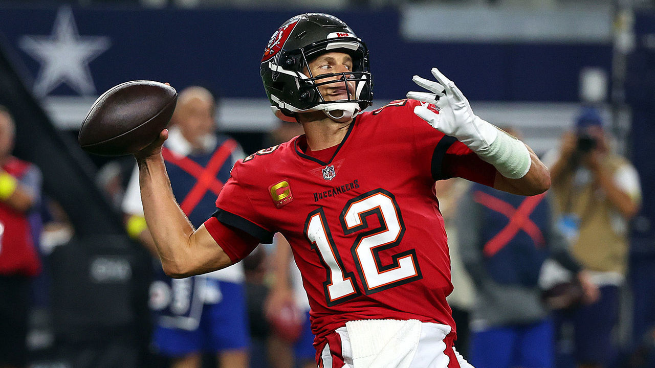 Tampa Bay Buccaneers quarterback Tom Brady (12) looks to hand off the ball  to cornerback Sean M …