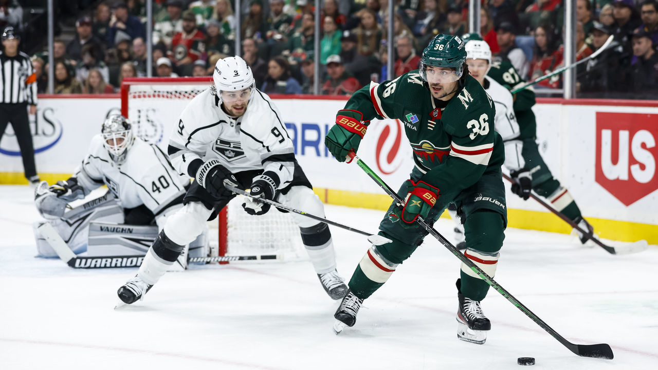 ST PAUL, MN - OCTOBER 15: Mats Zuccarello #36 of the Minnesota Wild skates with the puck while Adrian Kempe #9 of the Los Angeles Kings defends in the second period of the game at Xcel Energy Center on October 15, 2022 in St Paul, Minnesota.