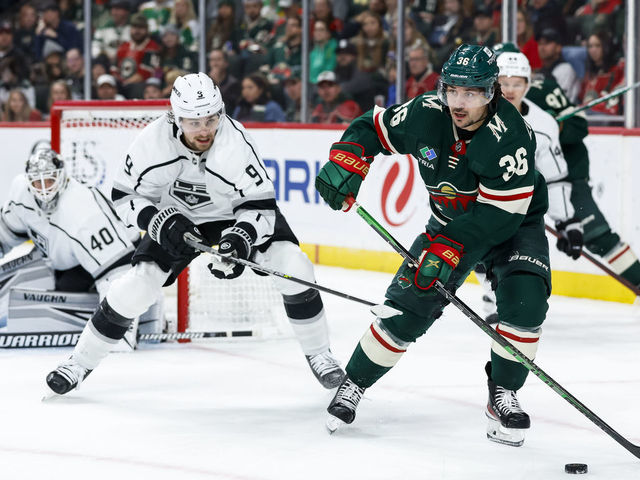 ST PAUL, MN - OCTOBER 15: Mats Zuccarello #36 of the Minnesota Wild skates with the puck while Adrian Kempe #9 of the Los Angeles Kings defends in the second period of the game at Xcel Energy Center on October 15, 2022 in St Paul, Minnesota.