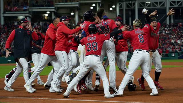 CLEVELAND, OHIO - OCTOBER 15: Oscar Gonzalez #39 of the Cleveland Guardians celebrates with his team after hitting a two run single during the ninth inning against the New York Yankees in game three of the American League Division Series at Progressive Field on October 15, 2022 in Cleveland, Ohio.