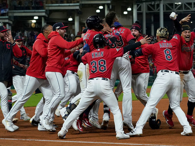 CLEVELAND, OHIO - OCTOBER 15: Oscar Gonzalez #39 of the Cleveland Guardians celebrates with his team after hitting a two run single during the ninth inning against the New York Yankees in game three of the American League Division Series at Progressive Field on October 15, 2022 in Cleveland, Ohio.