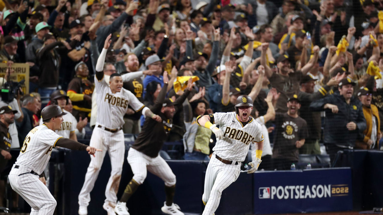SAN DIEGO, CALIFORNIA - OCTOBER 15: Jake Cronenworth #9 of the San Diego Padres celebrates after hitting a two-run RBI single during the seventh inning against the Los Angeles Dodgers in game four of the National League Division Series at PETCO Park on October 15, 2022 in San Diego, California.