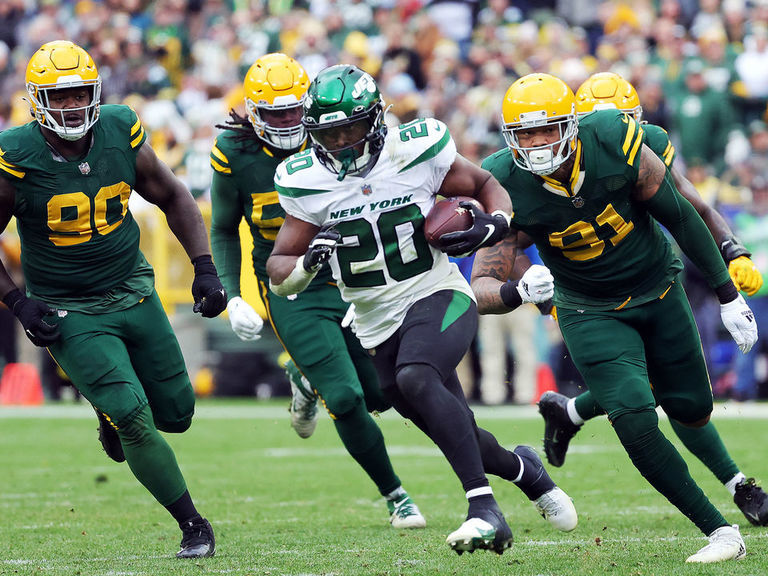 Lambeau Leap! Patrick Taylor celebrates after TD run