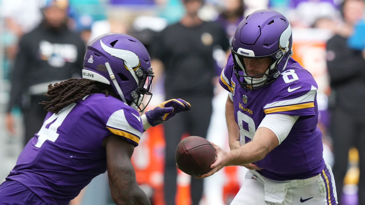 MIAMI GARDENS, FLORIDA - OCTOBER 16: Kirk Cousins #8 of the Minnesota Vikings hands off to Dalvin Cook #4 of the Minnesota Vikings during the second half against the Miami Dolphins at Hard Rock Stadium on October 16, 2022 in Miami Gardens, Florida.
