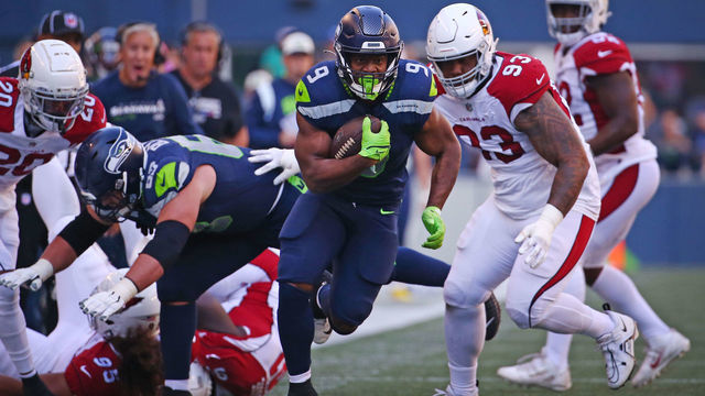 SEATTLE, WASHINGTON - OCTOBER 16: Kenneth Walker III #9 of the Seattle Seahawks runs against the Arizona Cardinals during the third quarter at Lumen Field on October 16, 2022 in Seattle, Washington.