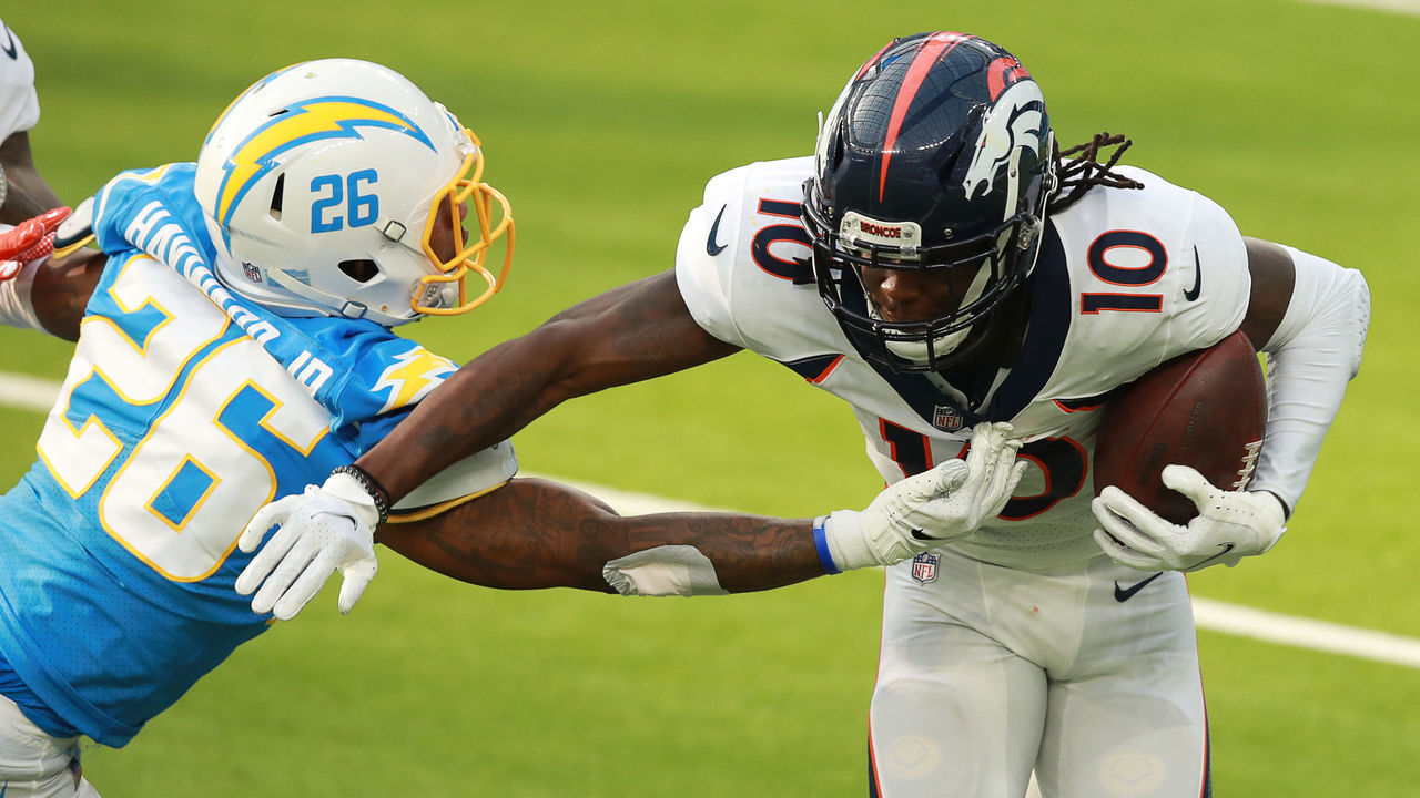 INGLEWOOD, CALIFORNIA - DECEMBER 27: Jerry Jeudy #10 of the Denver Broncos runs against Casey Hayward #26 of the Los Angeles Chargers in the second quarter at SoFi Stadium on December 27, 2020 in Inglewood, California.