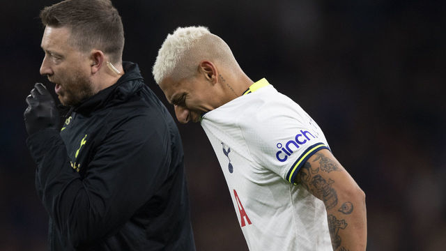 LONDON, ENGLAND - OCTOBER 15: Richarlison of Tottenham Hotspur walks off the pitch with a member of the Tottenham medical staff after picking up an injury to his injured left calf during the Premier League match between Tottenham Hotspur and Everton FC at Tottenham Hotspur Stadium on October 15, 2022 in London, England.