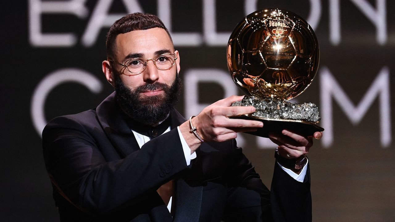 Real Madrid's French forward Karim Benzema receives the Ballon d'Or award during the 2022 Ballon d'Or France Football award ceremony at the Theatre du Chatelet in Paris on October 17, 2022.