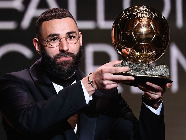 Real Madrid's French forward Karim Benzema receives the Ballon d'Or award during the 2022 Ballon d'Or France Football award ceremony at the Theatre du Chatelet in Paris on October 17, 2022.