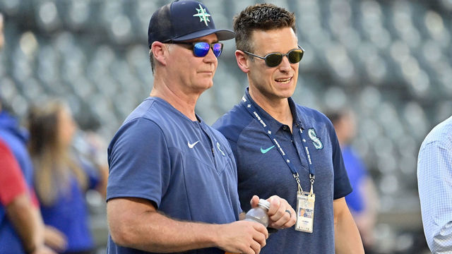 SEATTLE, WASHINGTON - JULY 26: Manager Scott Servais #9 and Baseball Operations President Jerry Dipoto of the Seattle Mariners watch batting practice before the game against the Texas Rangers at T-Mobile Park on July 26, 2022 in Seattle, Washington.