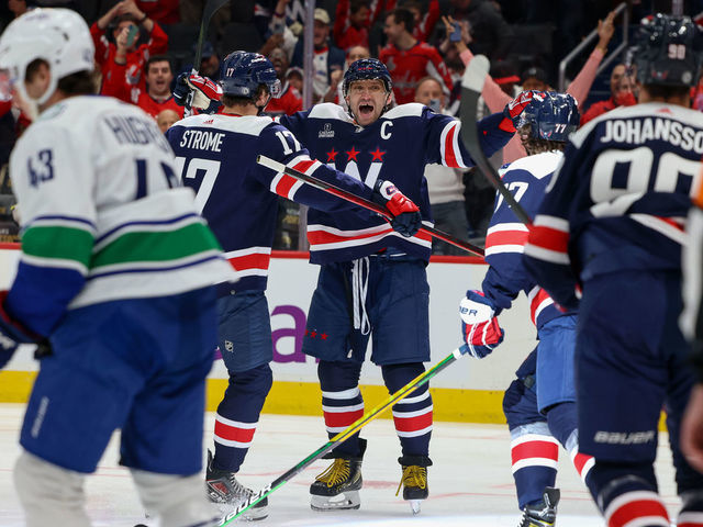 WASHINGTON, DC - OCTOBER 17: Alex Ovechkin #8 of the Washington Capitals celebrates a goal with Dylan Strome #17, T.J. Oshie #77 and Marcus Johansson #90 during a game against the Vancouver Canucks at Capital One Arena on October 17, 2022 in Washington, D.C.