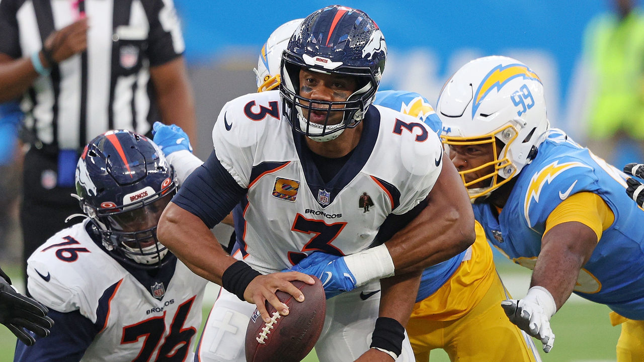 INGLEWOOD, CALIFORNIA - OCTOBER 17: Russell Wilson #3 of the Denver Broncos is sacked by Khalil Mack #52 of the Los Angeles Chargers during the first quarter at SoFi Stadium on October 17, 2022 in Inglewood, California.