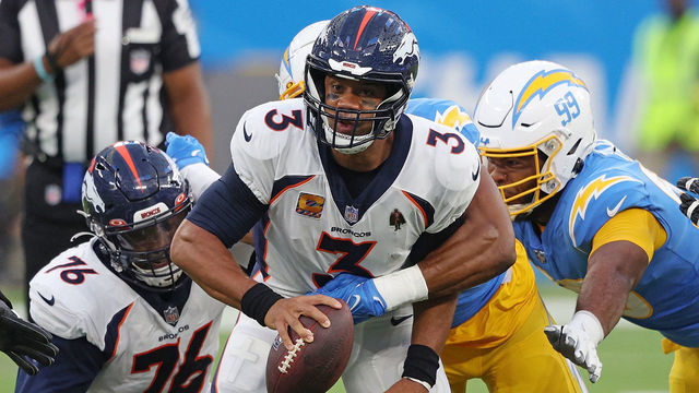 INGLEWOOD, CALIFORNIA - OCTOBER 17: Russell Wilson #3 of the Denver Broncos is sacked by Khalil Mack #52 of the Los Angeles Chargers during the first quarter at SoFi Stadium on October 17, 2022 in Inglewood, California.