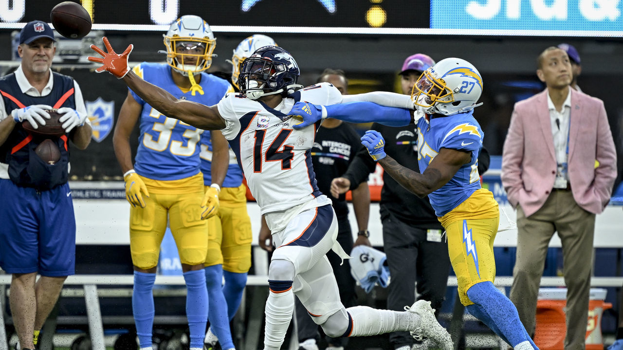 INGLEWOOD, CA - OCTOBER 17: J.C. Jackson (27) of the Los Angeles Chargers gets called for pass interference, while defending Courtland Sutton (14) of the Denver Broncos during the first quarter at SoFi Stadium in Inglewood, California on Monday, October 17, 2022.