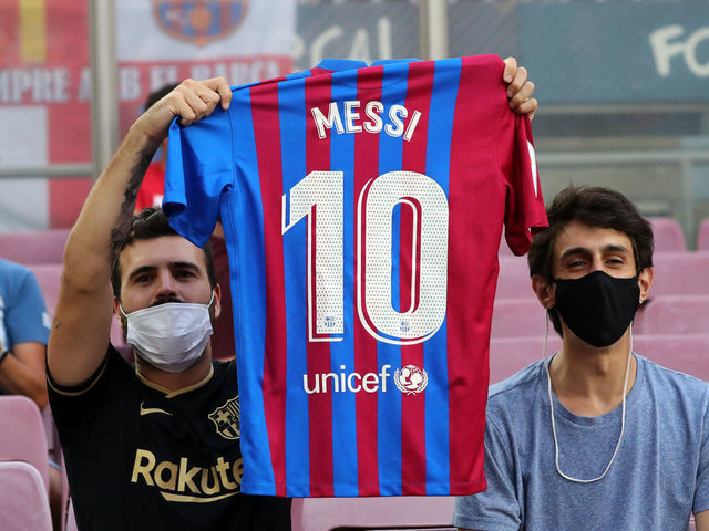 Getty Images - A fan wears a jersey of Lionel Messi