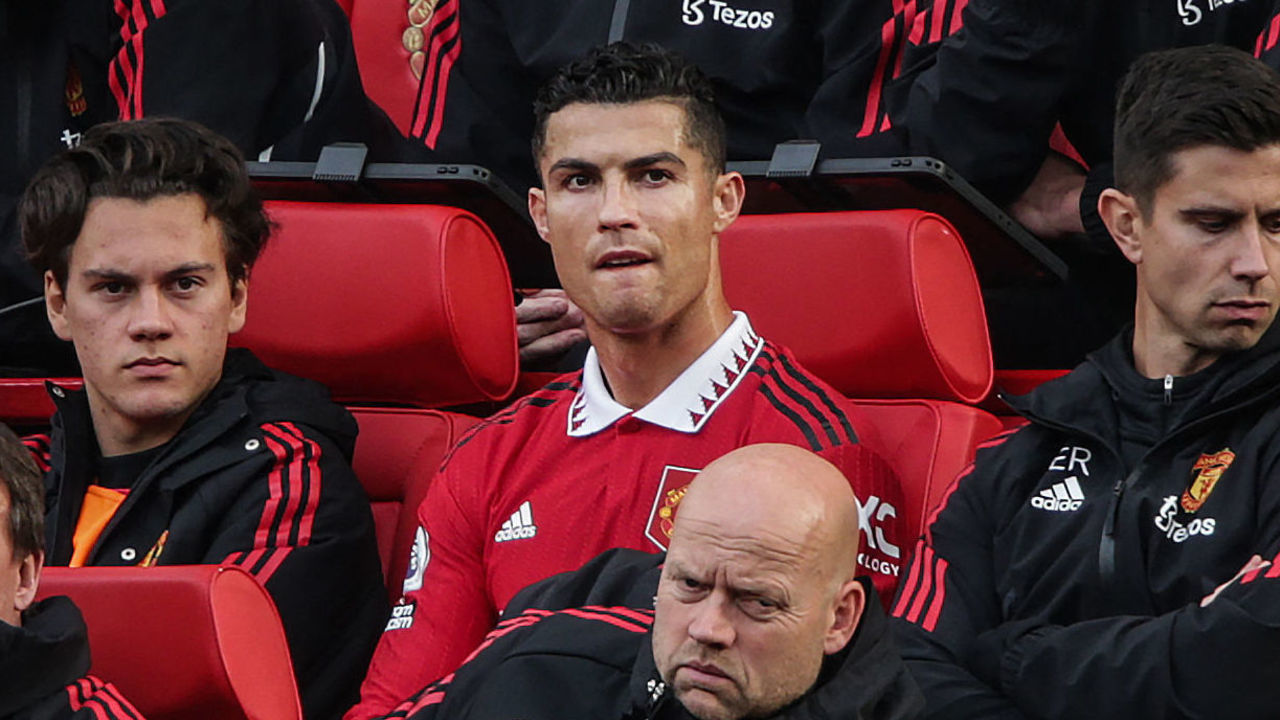 Manchester United's Portuguese striker Cristiano Ronaldo (C) reacts as he sits on the bench during the English Premier League football match between Manchester United and Newcastle at Old Trafford in Manchester, north west England, on October 16, 2022. - RESTRICTED TO EDITORIAL USE. No use with unauthorized audio, video, data, fixture lists, club/league logos or 'live' services. Online in-match use limited to 120 images. An additional 40 images may be used in extra time. No video emulation. Social media in-match use limited to 120 images. An additional 40 images may be used in extra time. No use in betting publications, games or single club/league/player publications.