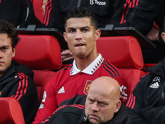 Manchester United's Portuguese striker Cristiano Ronaldo (C) reacts as he sits on the bench during the English Premier League football match between Manchester United and Newcastle at Old Trafford in Manchester, north west England, on October 16, 2022. - RESTRICTED TO EDITORIAL USE. No use with unauthorized audio, video, data, fixture lists, club/league logos or 'live' services. Online in-match use limited to 120 images. An additional 40 images may be used in extra time. No video emulation. Social media in-match use limited to 120 images. An additional 40 images may be used in extra time. No use in betting publications, games or single club/league/player publications.