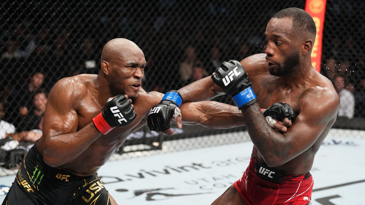SALT LAKE CITY, UTAH - AUGUST 20: (L-R) Kamaru Usman of Nigeria punches Leon Edwards of Jamaica in the UFC welterweight championship fight during the UFC 278 event at Vivint Arena on August 20, 2022 in Salt Lake City, Utah.