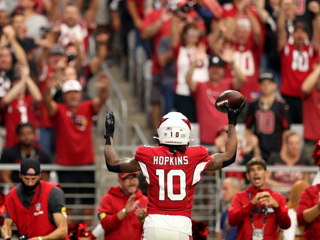 GLENDALE, ARIZONA - OCTOBER 24: DeAndre Hopkins #10 of the Arizona Cardinals celebrates after scoring a touchdown in the second quarter against the Houston Texans in the game at State Farm Stadium on October 24, 2021 in Glendale, Arizona.