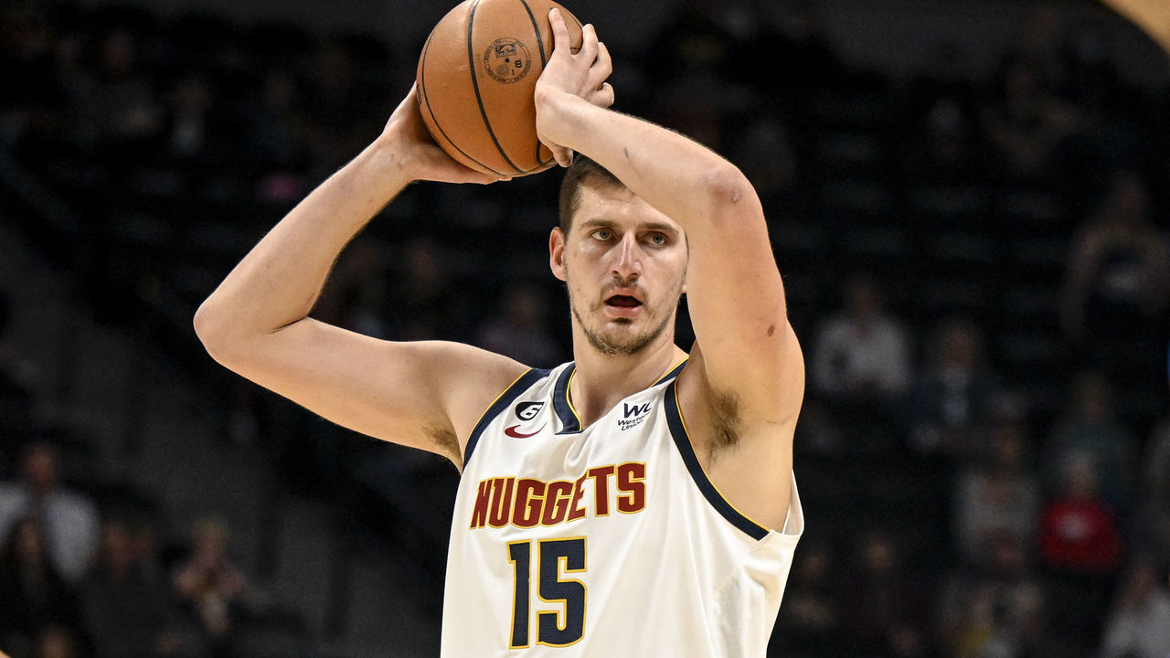 DENVER, CO - OCTOBER 3: Nikola Jokic (15) of the Denver Nuggets handles the ball as Jeremiah Robinson-Earl (50) of the Oklahoma City Thunder during the first quarter on Monday, October 3, 2022.