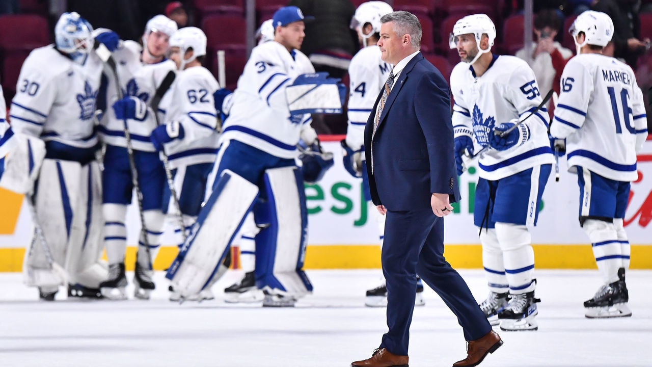 MONTREAL, CANADA - OCTOBER 03: Head coach of the Toronto Maple Leafs, Sheldon Keefe, walks across the ice after a victory against the Montreal Canadiens in a preseason game at Centre Bell on October 3, 2022 in Montreal, Quebec, Canada. The Toronto Maple Leafs defeated the Montreal Canadiens 5-1.