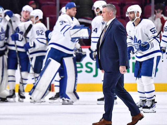 MONTREAL, CANADA - OCTOBER 03: Head coach of the Toronto Maple Leafs, Sheldon Keefe, walks across the ice after a victory against the Montreal Canadiens in a preseason game at Centre Bell on October 3, 2022 in Montreal, Quebec, Canada. The Toronto Maple Leafs defeated the Montreal Canadiens 5-1.
