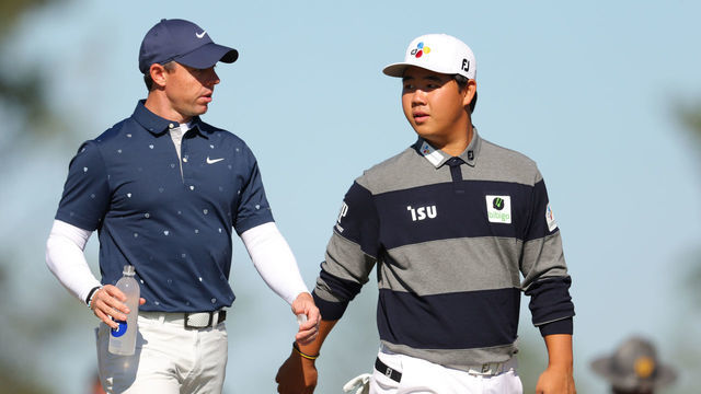 RIDGELAND, SOUTH CAROLINA - OCTOBER 20: Rory McIlroy of Northern Ireland and Tom Kim of South Korea walks on the second hole during the first round of the CJ Cup at Congaree Golf Club on October 20, 2022 in Ridgeland, South Carolina.
