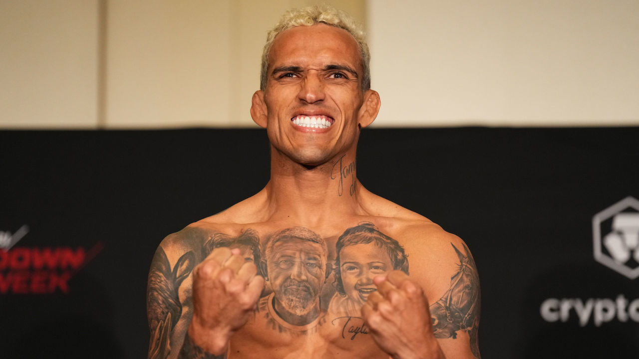 ABU DHABI, UNITED ARAB EMIRATES - OCTOBER 21: Charles Oliveira of Brazil poses on the scale during the UFC 280 official weigh-in at Crowne Plaza Yas Island on October 21, 2022 in Abu Dhabi, United Arab Emirates.