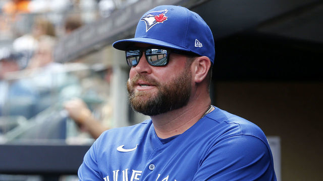 NEW YORK, NEW YORK - AUGUST 21: Manager John Schneider #14 of the Toronto Blue Jays looks on before a game against the New York Yankees at Yankee Stadium on August 21, 2022 in New York City. The Yankees defeated the Blue Jays 4-2.