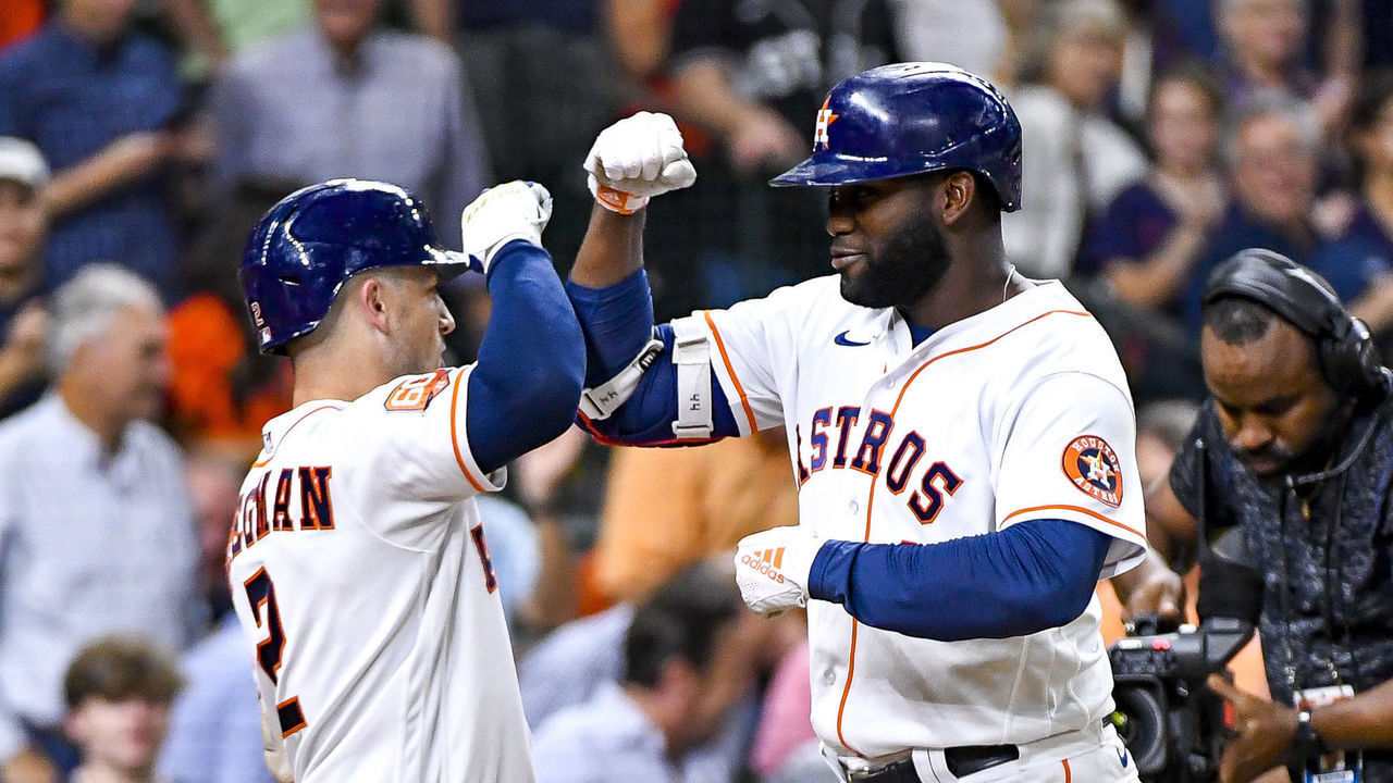 HOUSTON, TEXAS - AUGUST 10: Yordan Alvarez #44 of the Houston Astros celebrates a solo home run with Alex Bregman #2 in the seventh inning against the Texas Rangers at Minute Maid Park on August 10, 2022 in Houston, Texas.