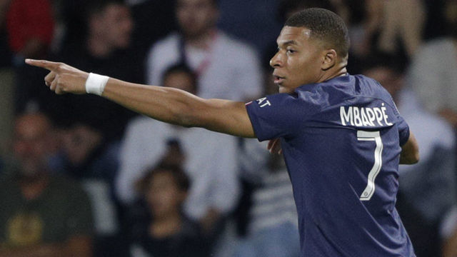 Paris Saint-Germain's French forward Kylian Mbappe celebrates after scoring a goal during the French L1 football match between AC Ajaccio and Paris Saint-Germain (PSG) at the Francois Coty Stadium in Ajaccio, Corsica, on October 21, 2022.