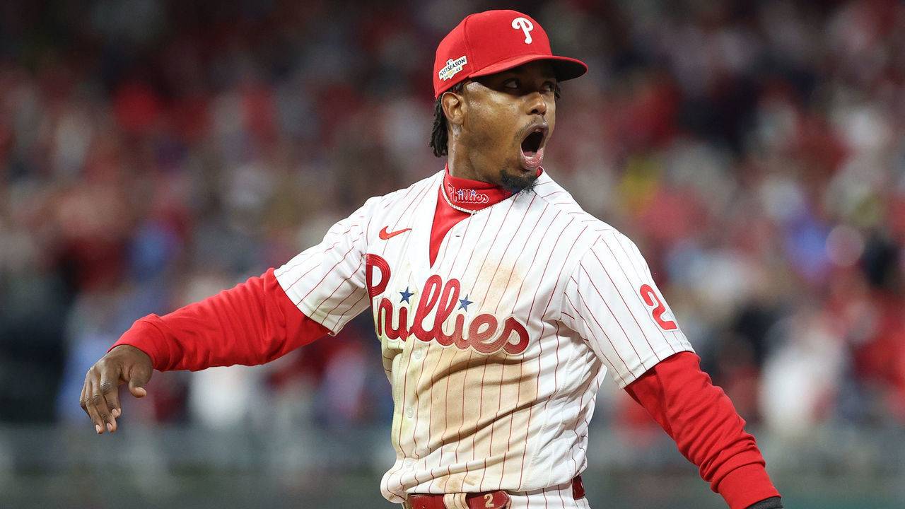 PHILADELPHIA, PENNSYLVANIA - OCTOBER 21: Jean Segura #2 of the Philadelphia Phillies celebrates with Nick Castellanos #8 after making a diving stop and throwing out Ha-Seong Kim #7 of the San Diego Padres (not pictured) at first base during the seventh inning in game three of the National League Championship Series at Citizens Bank Park on October 21, 2022 in Philadelphia, Pennsylvania.
