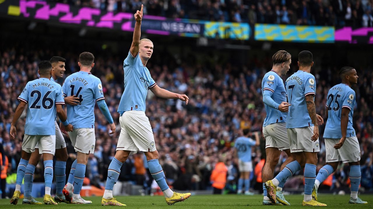 Manchester City's Norwegian striker Erling Haaland (C) celebrates scoring the opening goal during the English Premier League football match between Manchester City and Brighton and Hove Albion at the Etihad Stadium in Manchester, north west England, on October 22, 2022. - RESTRICTED TO EDITORIAL USE. No use with unauthorized audio, video, data, fixture lists, club/league logos or 'live' services. Online in-match use limited to 120 images. An additional 40 images may be used in extra time. No video emulation. Social media in-match use limited to 120 images. An additional 40 images may be used in extra time. No use in betting publications, games or single club/league/player publications.