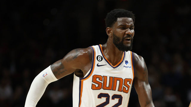 PORTLAND, OREGON - OCTOBER 21: Deandre Ayton #22 and Devin Booker #1 of the Phoenix Suns react during the second quarter against the Portland Trail Blazers during the second quarter at Moda Center on October 21, 2022 in Portland, Oregon.