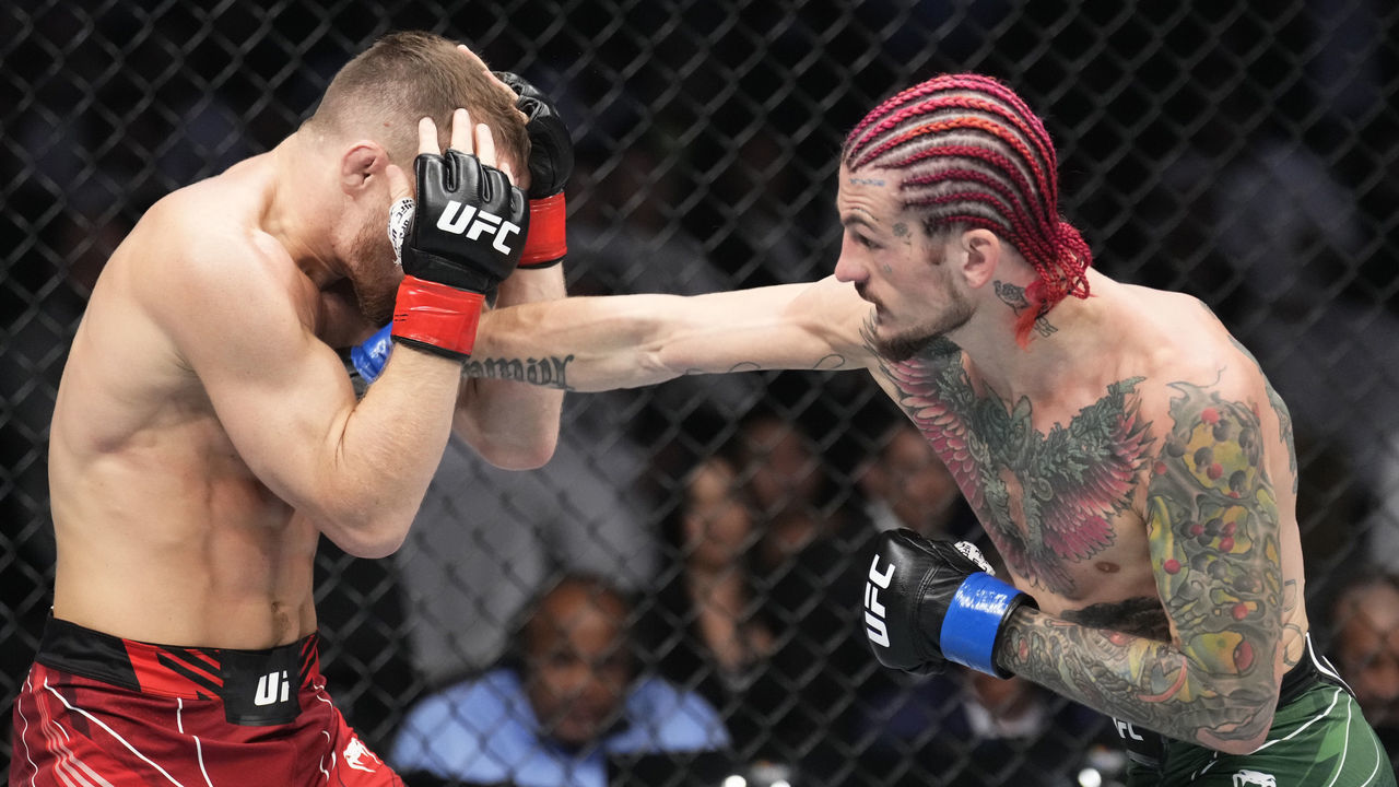 ABU DHABI, UNITED ARAB EMIRATES - OCTOBER 22: (R-L) Sean O'Malley punches Petr Yan of Russia in a bantamweight fight during the UFC 280 event at Etihad Arena on October 22, 2022 in Abu Dhabi, United Arab Emirates.