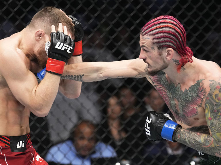 Sean O'Malley punches Petr Yan during their UFC 280 fight in October 2022