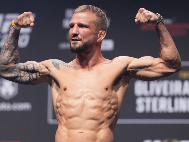 ABU DHABI, UNITED ARAB EMIRATES - OCTOBER 21: TJ Dillashaw poses on the scale during the UFC 280 ceremonial weigh-in at Etihad Arena on October 21, 2022 in Abu Dhabi, United Arab Emirates.