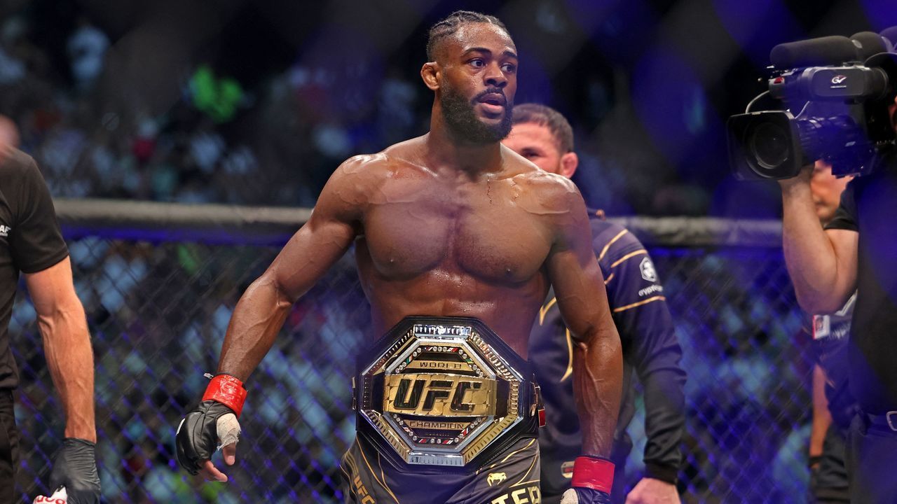 Aljamain Sterling wears the title belt after defeating TJ Dillashaw in the bantamweight championship at the Ultimate Fighting Championship (UFC) event at the Etihad Arena in Abu Dhabi on October 22, 2022.