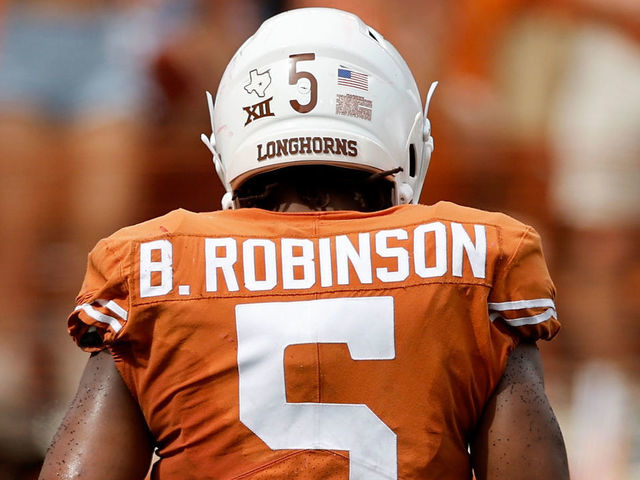 AUSTIN, TEXAS - OCTOBER 15: Bijan Robinson #5 of the Texas Longhorns walks to the sideline in the second half against the Iowa State Cyclones at Darrell K Royal-Texas Memorial Stadium on October 15, 2022 in Austin, Texas.