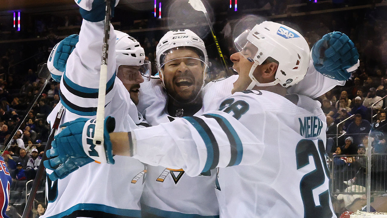NEW YORK, NEW YORK - OCTOBER 20: (L-R) Erik Karlsson #65, Tomas Hertl #48 and Timo Meier #28 of the San Jose Sharks celebrate Karlsson's overtime goal against the New York Rangers at Madison Square Garden on October 20, 2022 in New York City. The Sharks won 3-2 in overtime.