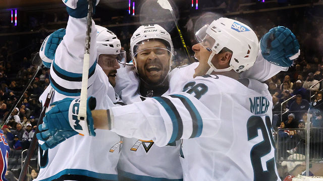 NEW YORK, NEW YORK - OCTOBER 20: (L-R) Erik Karlsson #65, Tomas Hertl #48 and Timo Meier #28 of the San Jose Sharks celebrate Karlsson's overtime goal against the New York Rangers at Madison Square Garden on October 20, 2022 in New York City. The Sharks won 3-2 in overtime.