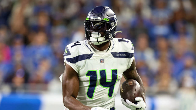Seattle Seahawks wide receiver DK Metcalf (14) carries the ball during an NFL football game between the Detroit Lions and the Seattle Seahawks in Detroit, Michigan USA, on Sunday, October 2, 2022.