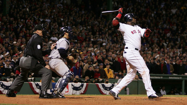 BOSTON - OCTOBER 18: David Ortiz #34 of the Boston Red Sox hits the game winning RBI single in the fourteenth inning to defeat the New York Yankees 5-4 during game five of the American League Championship Series on October 18, 2004 at Fenway Park in Boston, Massachusetts.